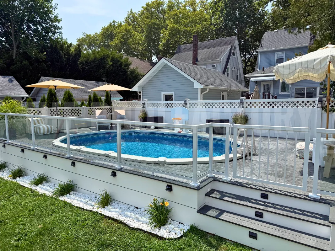 Contemporary backyard with oval saltwater pool, wraparound deck, and seating area