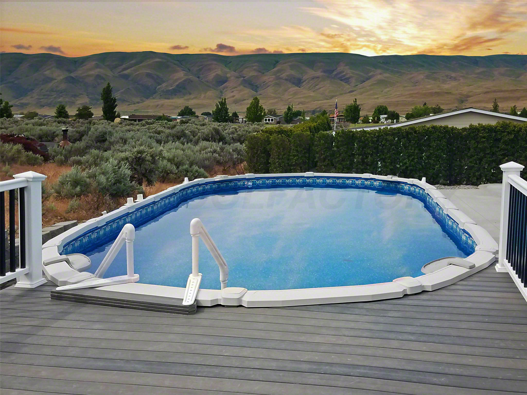 Oval above ground saltwater pool with partial deck and mountain back drop