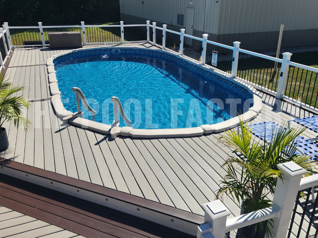 Oval semi inground saltwater pool with multi level deck and safety railing
