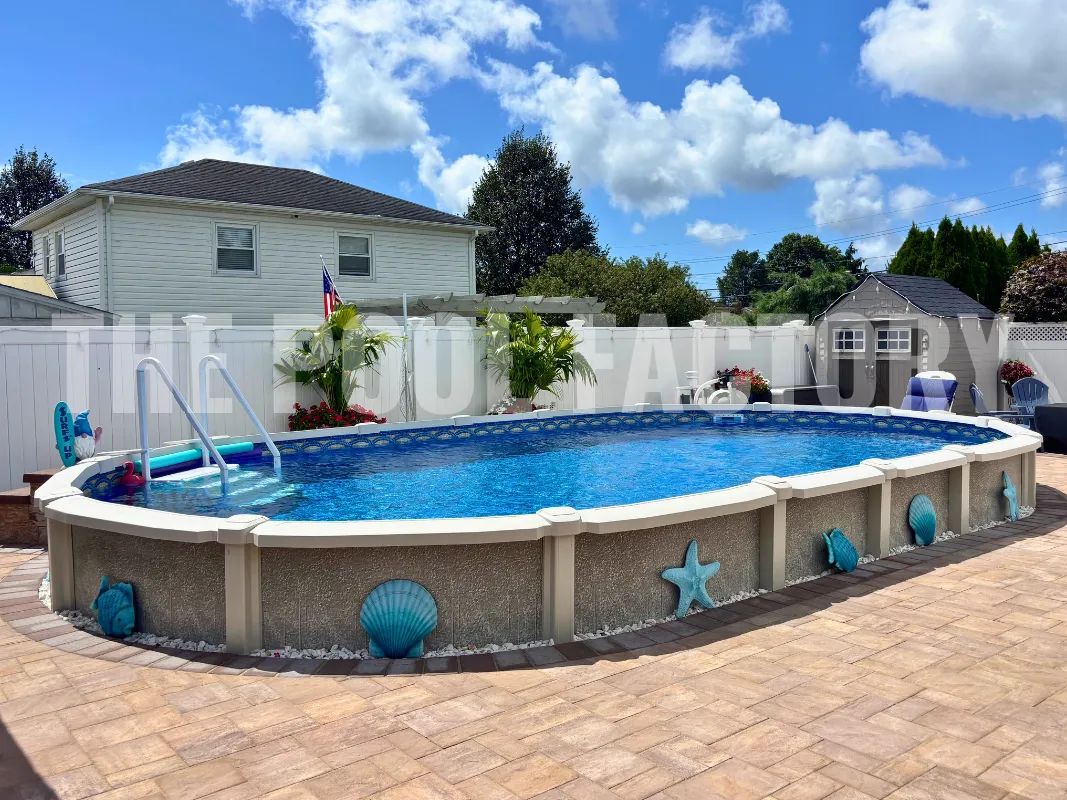 Serene backyard with oval saltwater pool, paver patio, and beach vibes