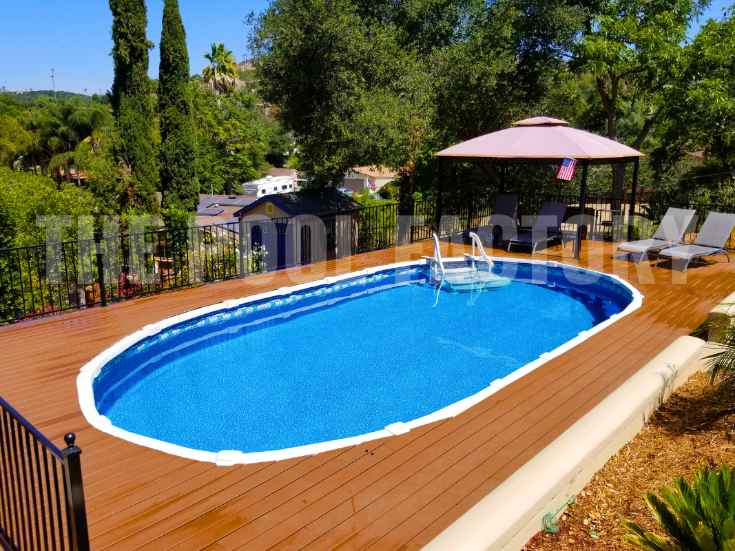 Saltwater above-ground pool with full deck and sunny landscaping surround
