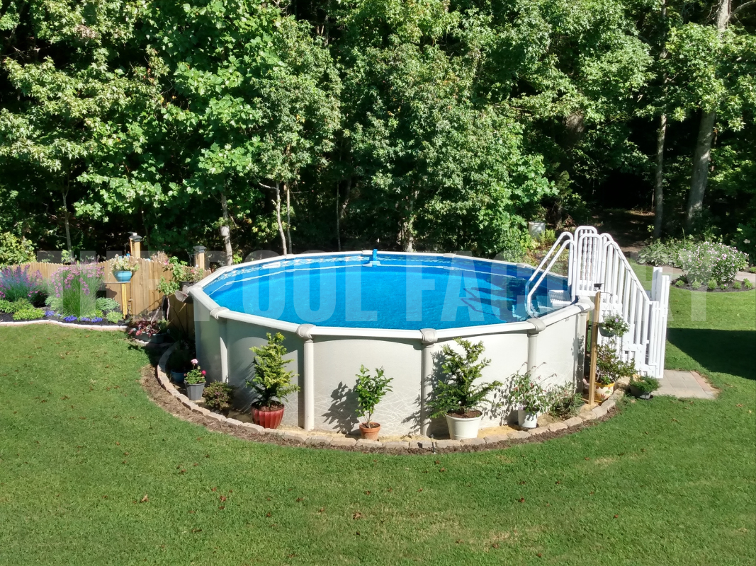 Backyard setup with round above-ground saltwater swimming pool and flower beds