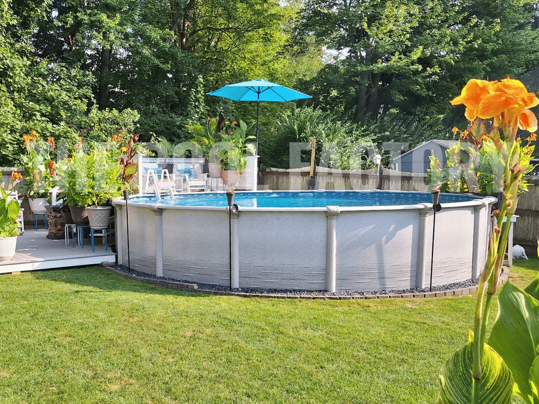 Above ground pool with partial deck, umbrella shade, and outdoor sofa set