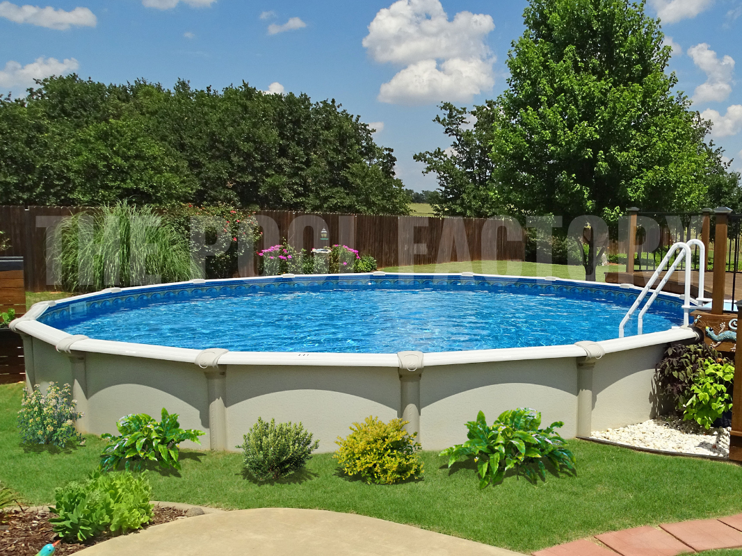 Semi-inground round swimming pool with lush greenery and surrounding tall trees