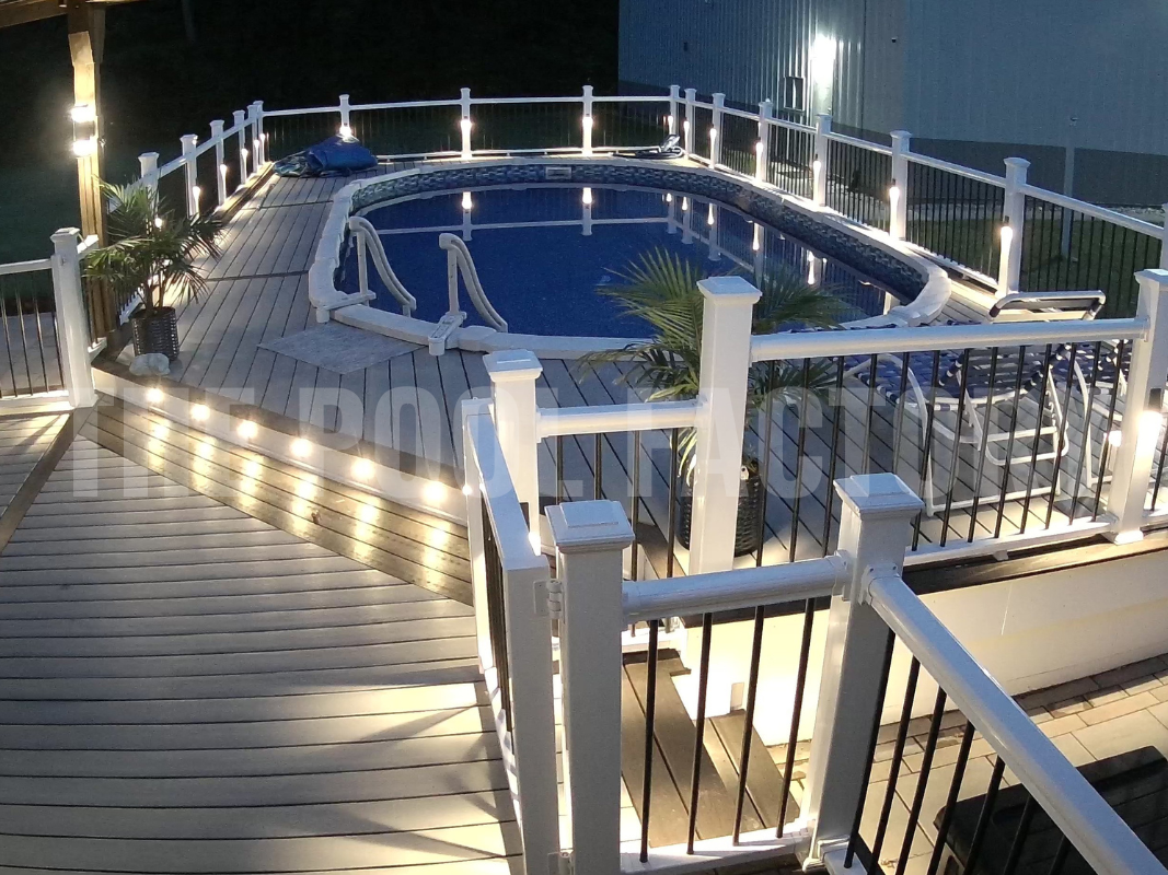 Semi inground oval saltwater pool with multi level deck and lighting for safety