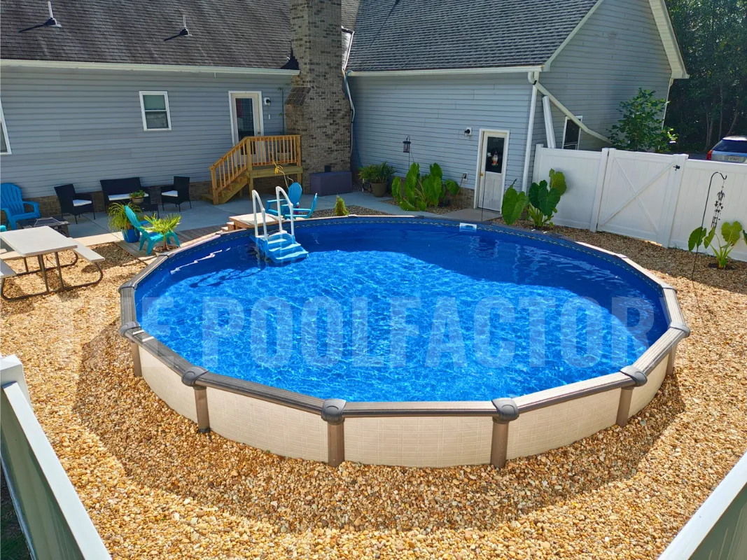 Round above ground pool with blue water and manicured landscaping around the pool