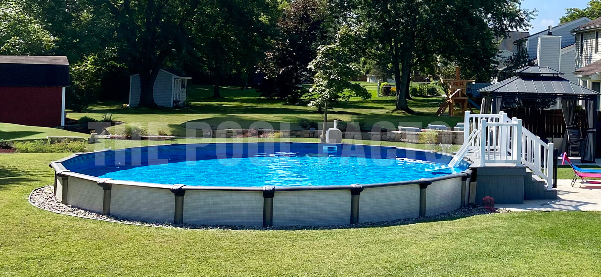 Backyard with semi-inground round pool, trees, and landscaping