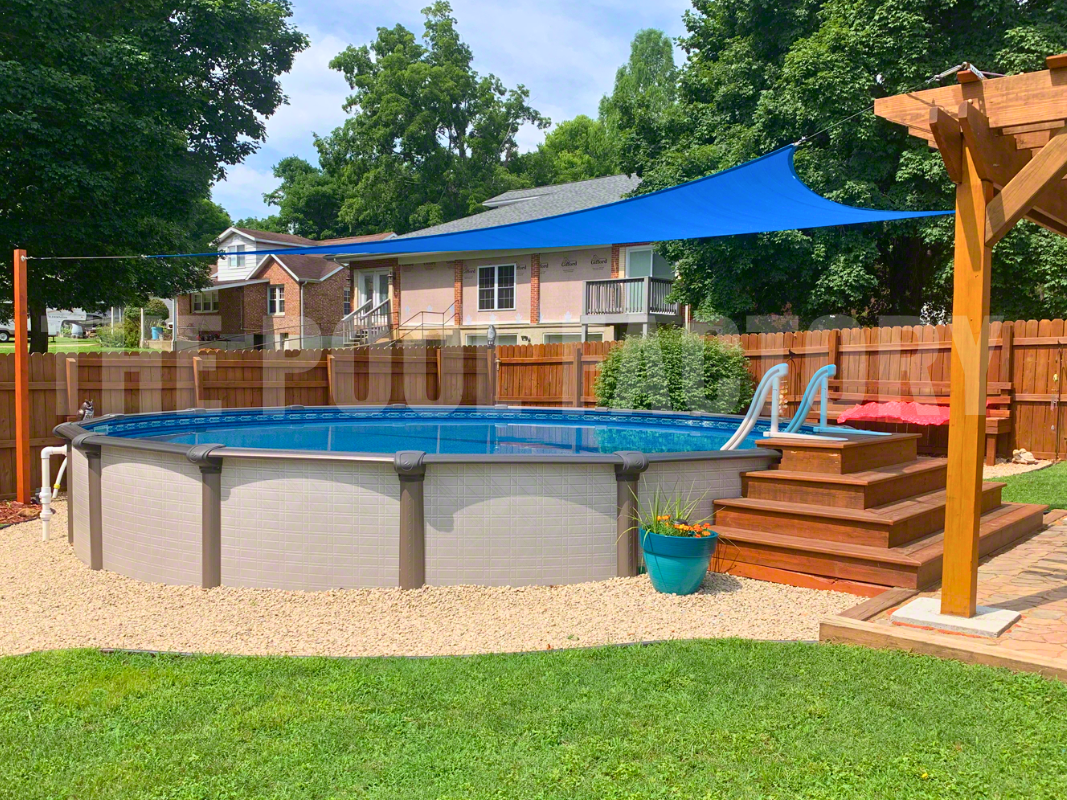 Semi-inground round pool with decorative rocks, steps and gazebo