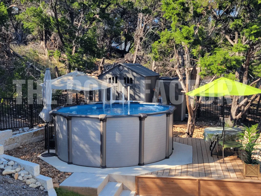 Above ground round pool with stone retaining wall and outdoor seating area