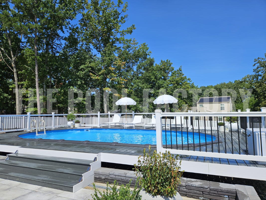 Oval semi-inground pool with easy-access steps and railings