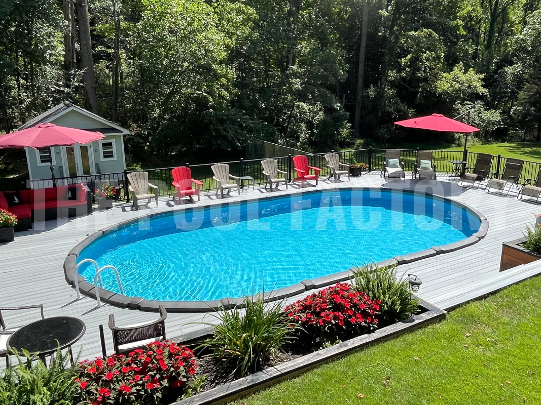 Semi inground saltwater pool with a full wrap around deck and colorful lounge chairs