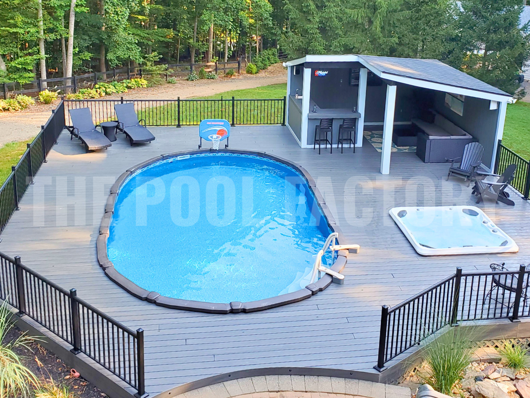 Saltwater oval swimming pool with a lounge area and outdoor bar
