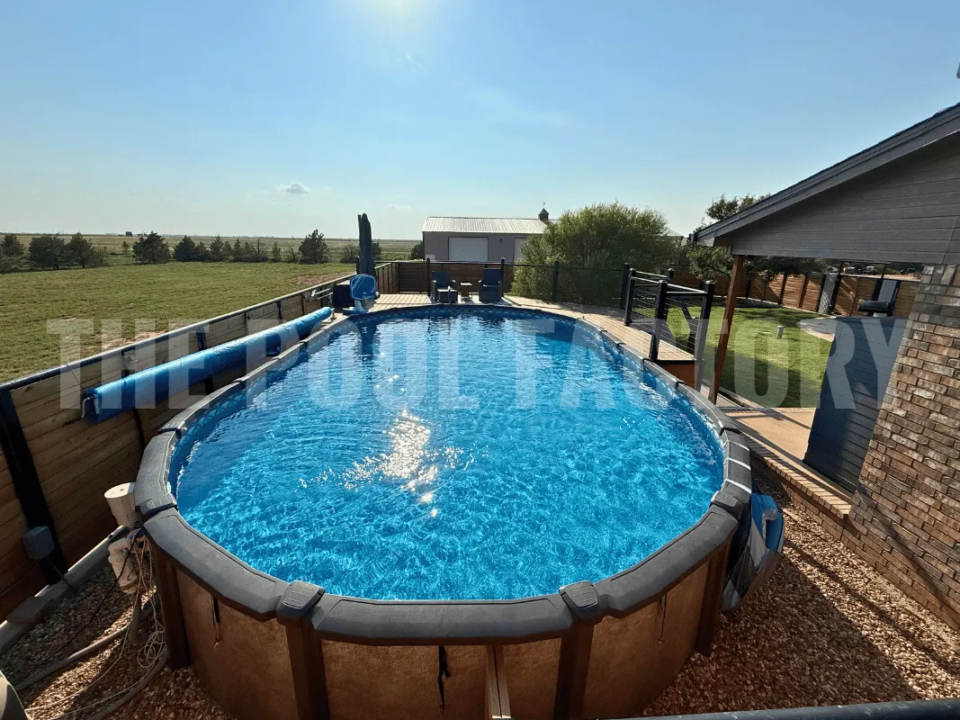 Oval saltwater pool with perfectly clear water and surrounding fence for safety