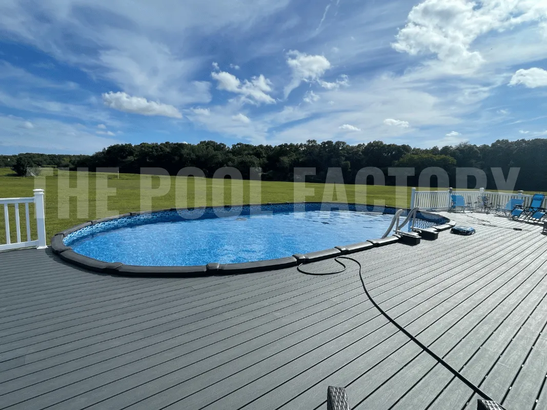 Oval semi-inground pool with spacious wraparound deck perfect for entertaining
