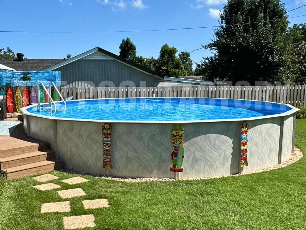 Backyard above ground pool with partial deck, decorative edging, and stone walkway