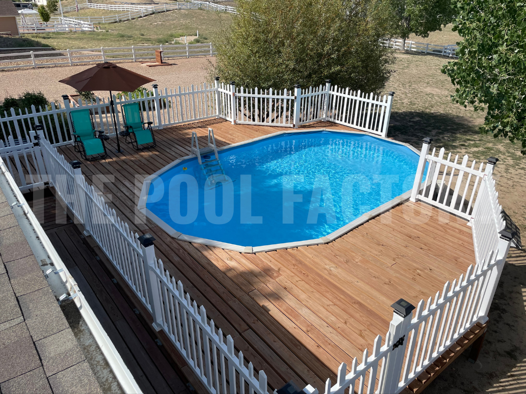 Backyard with an oval above ground pool and a privacy fence for safety