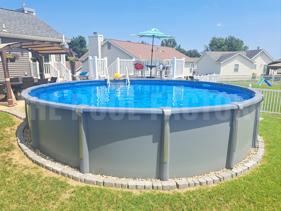 Round above ground saltwater swimming pool with decorative stone surrounding pool