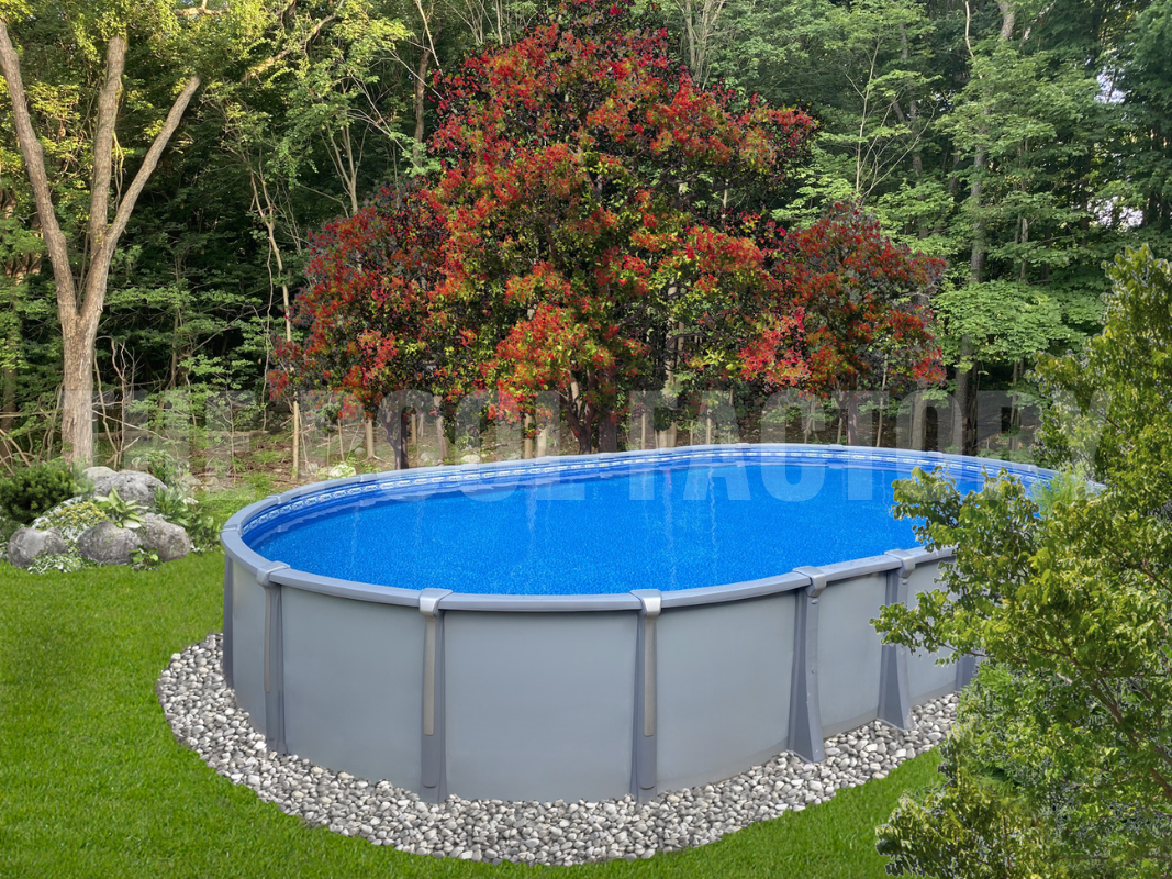 Oval saltwater swimming pool with landscaping rocks and forest backdrop
