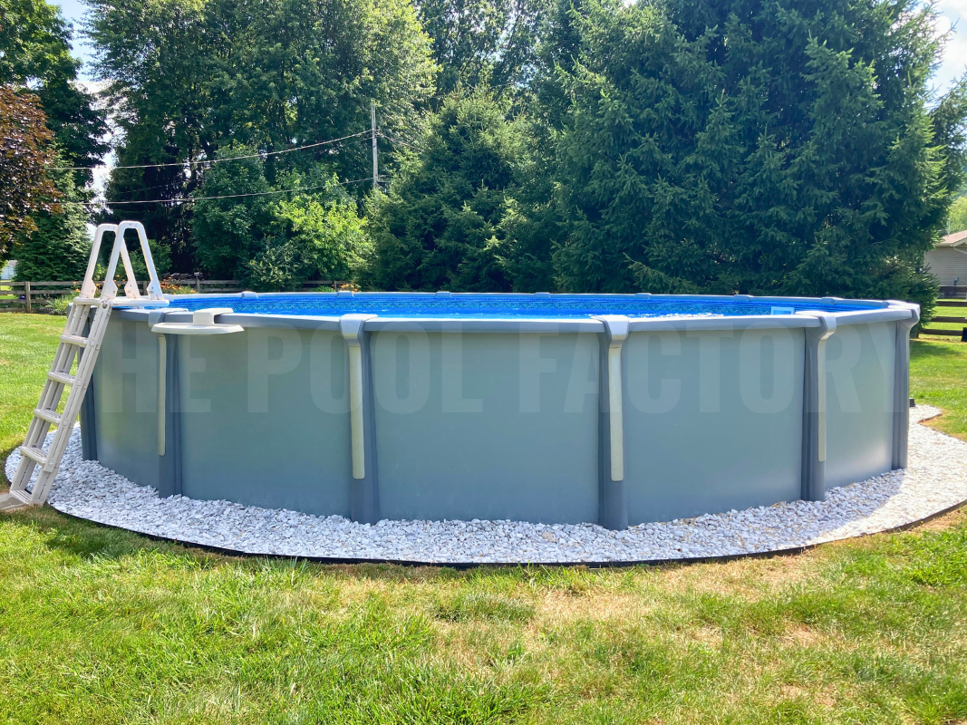 Round saltwater above ground pool with a backdrop of tall trees
