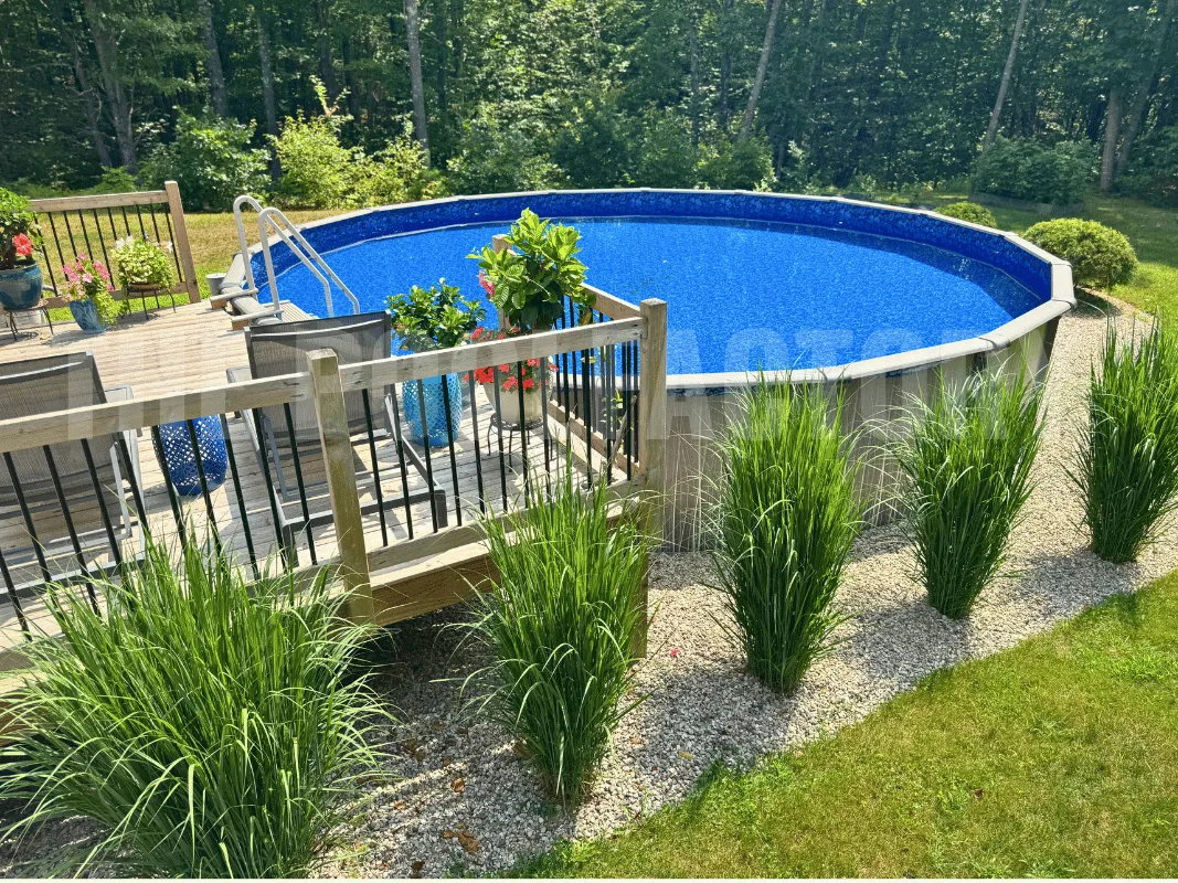 Above ground round swimming pool with decorative deck& fencing and cozy seating area
