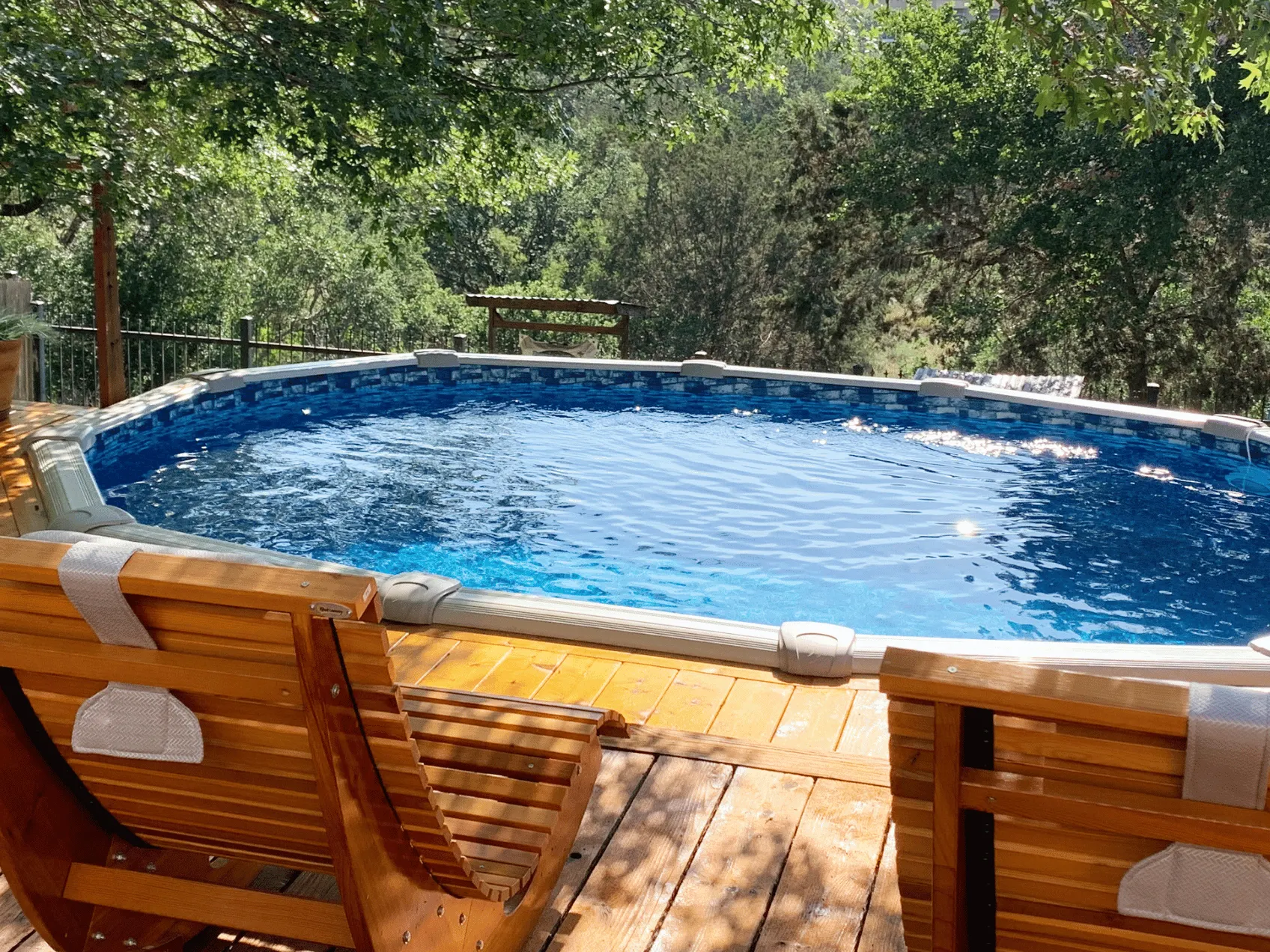 Bluestone oval overlap pool liner in a Signature RTL oval pool