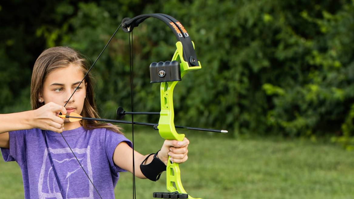 Young girl about to shoot a Bear Archery Brave Youth Bow