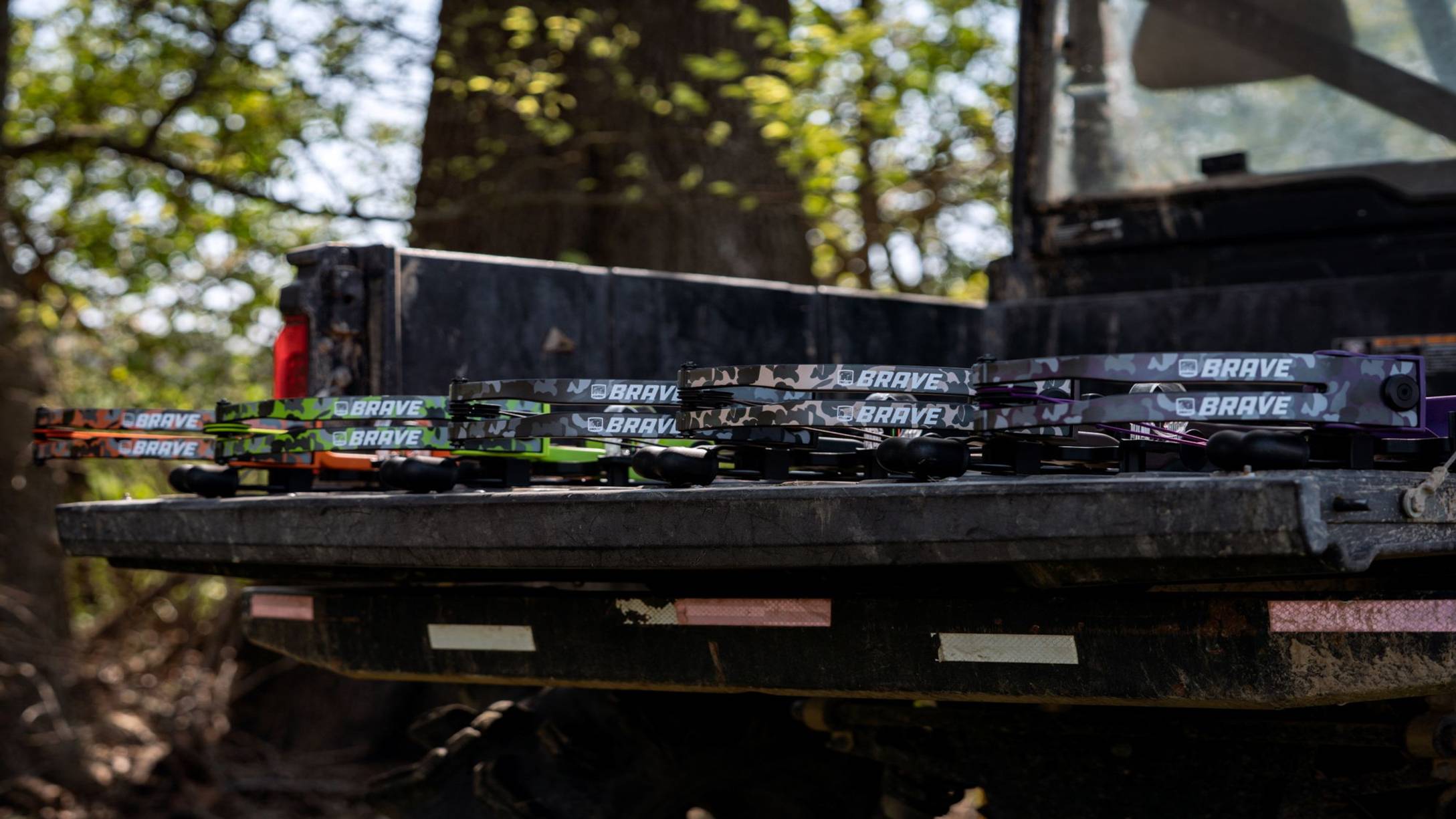 Bear Archery Brave youth archery bows sitting on the back of a side by side. 