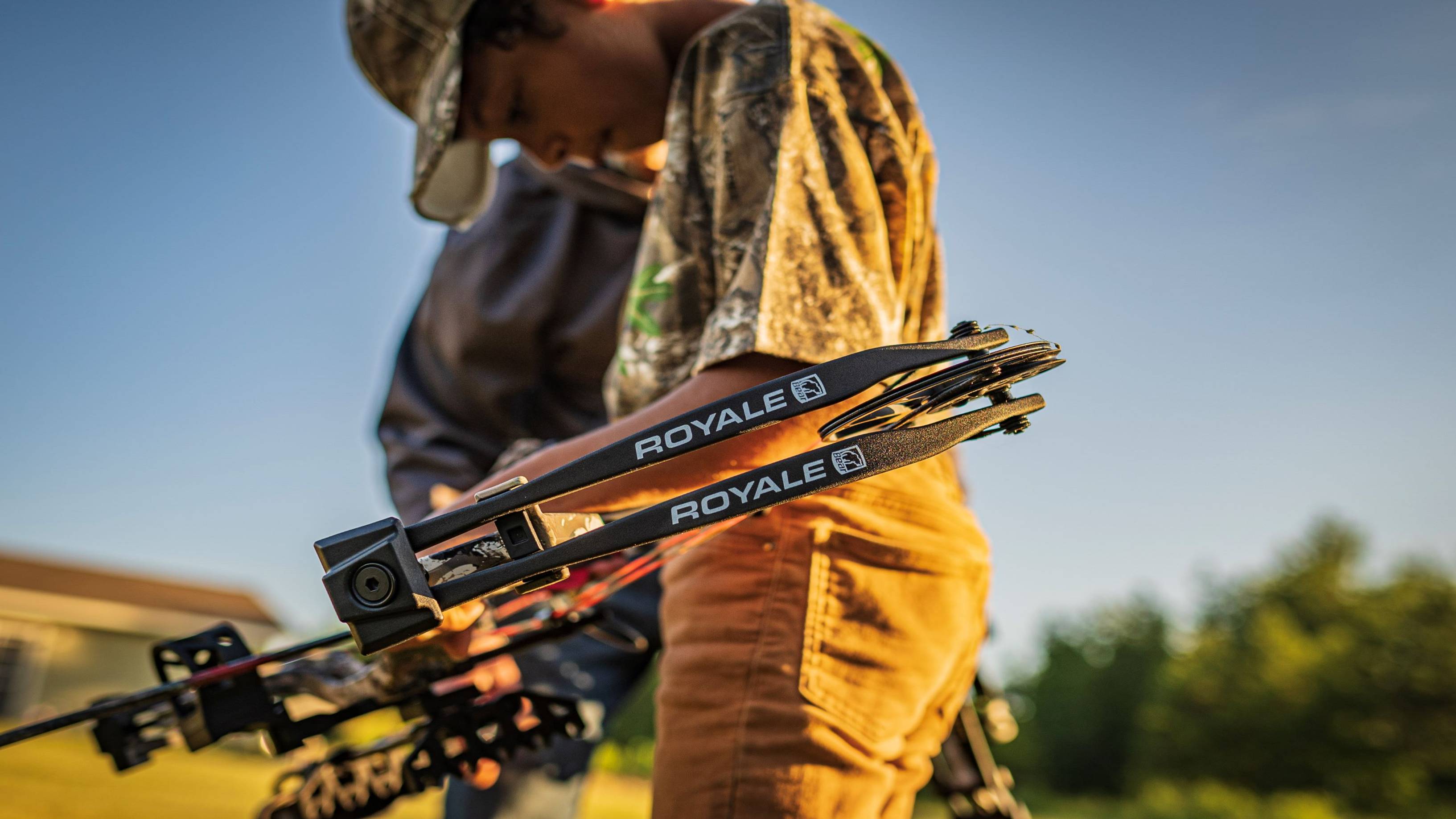 Boy holding Bear Archery Royale Youth compound bow