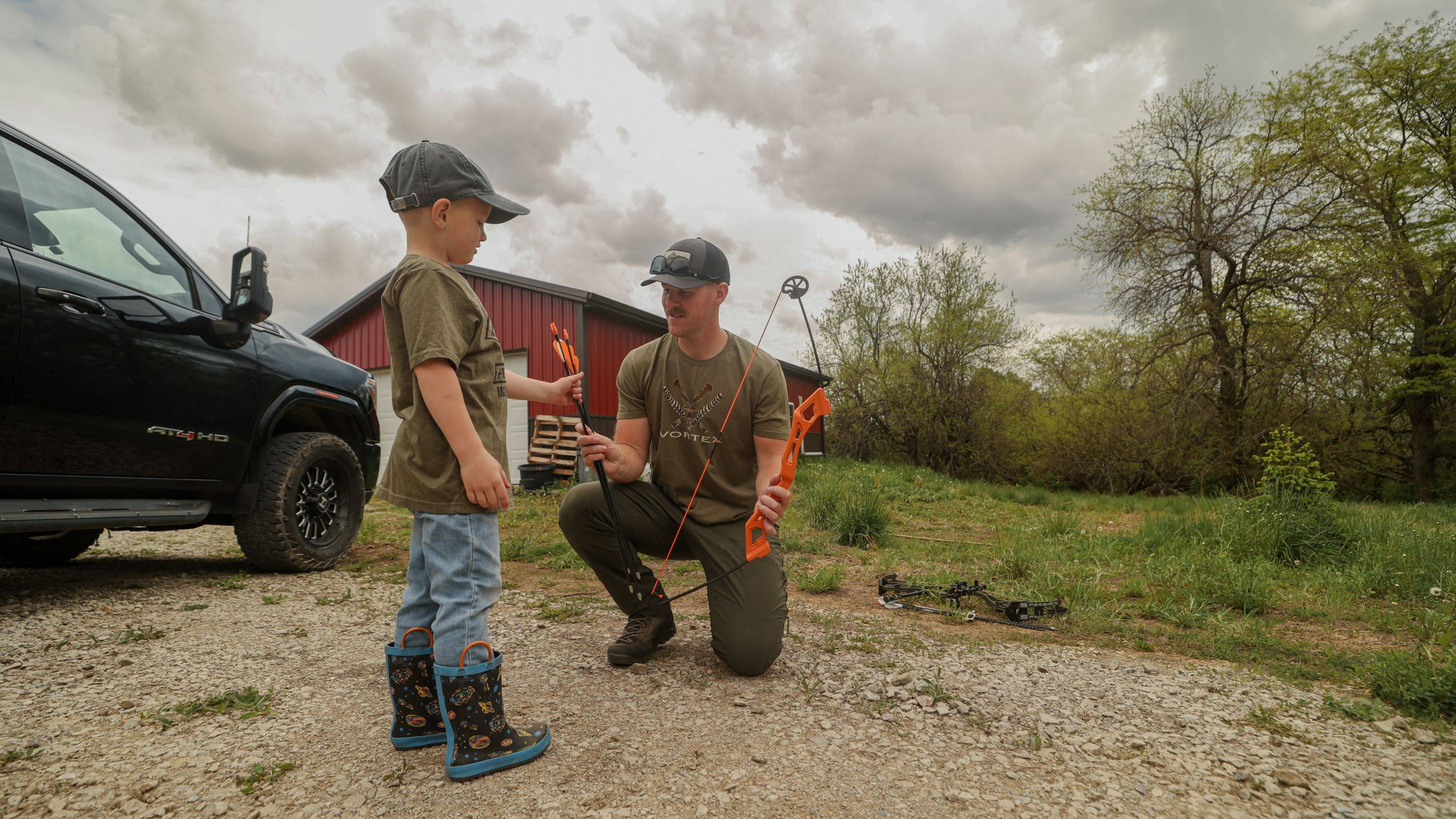 Father and son with the Spark youth bow from Bear Archery