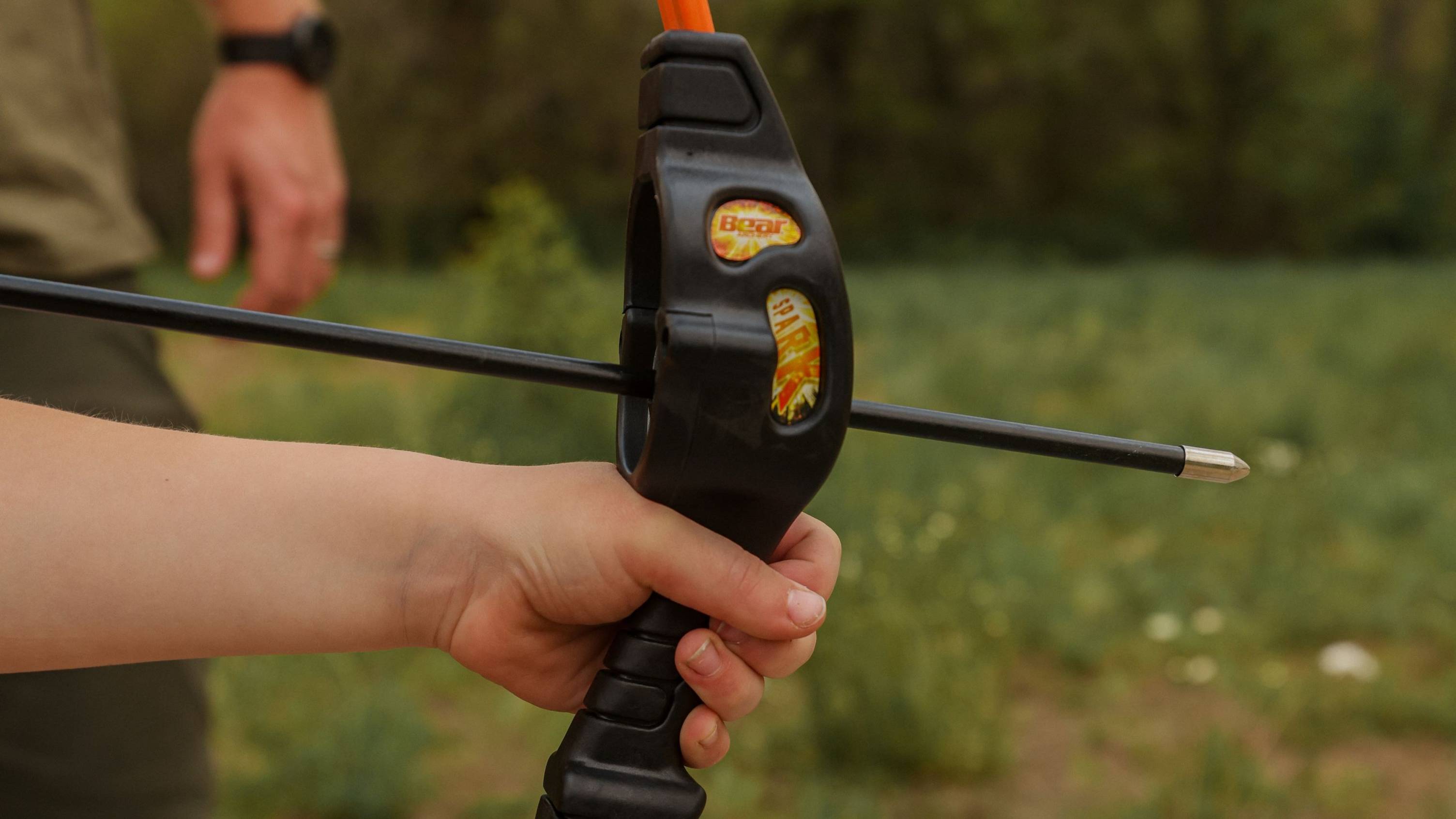 Close up of the grip on the Spark youth bow from Bear Archery