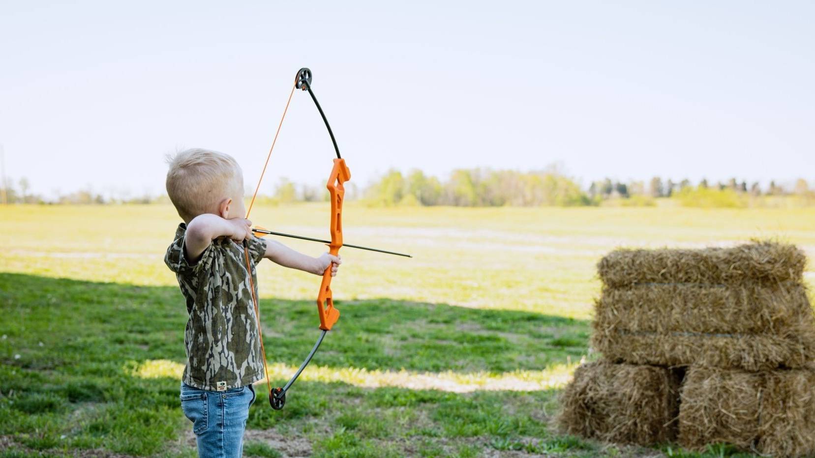Child shooting the Valiant youth bow from Bear Archery