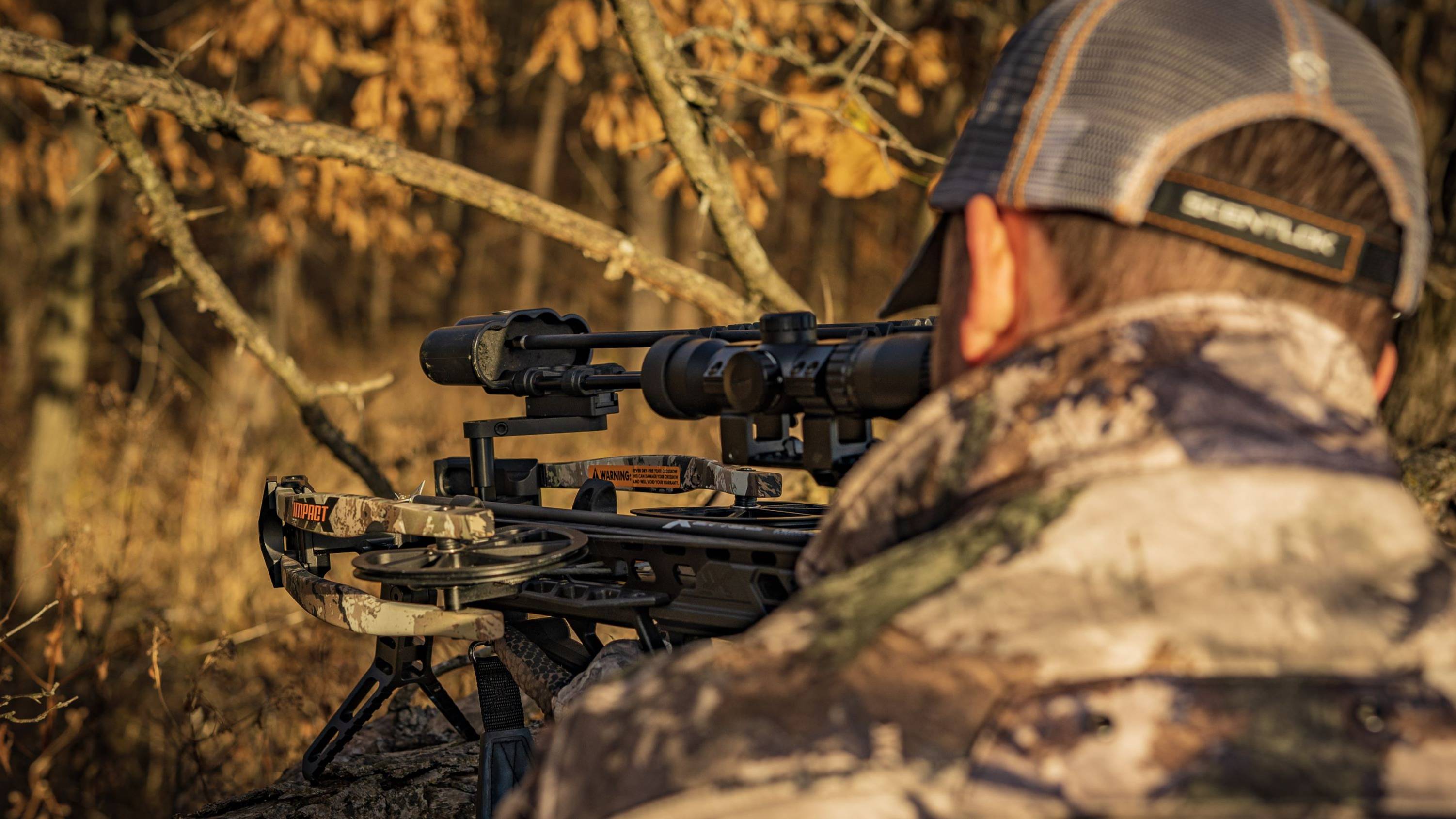 Man aiming the Impact Crossbow from BearX