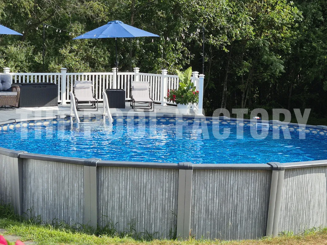 Above ground pool with deck and umbrella seating in summer sun