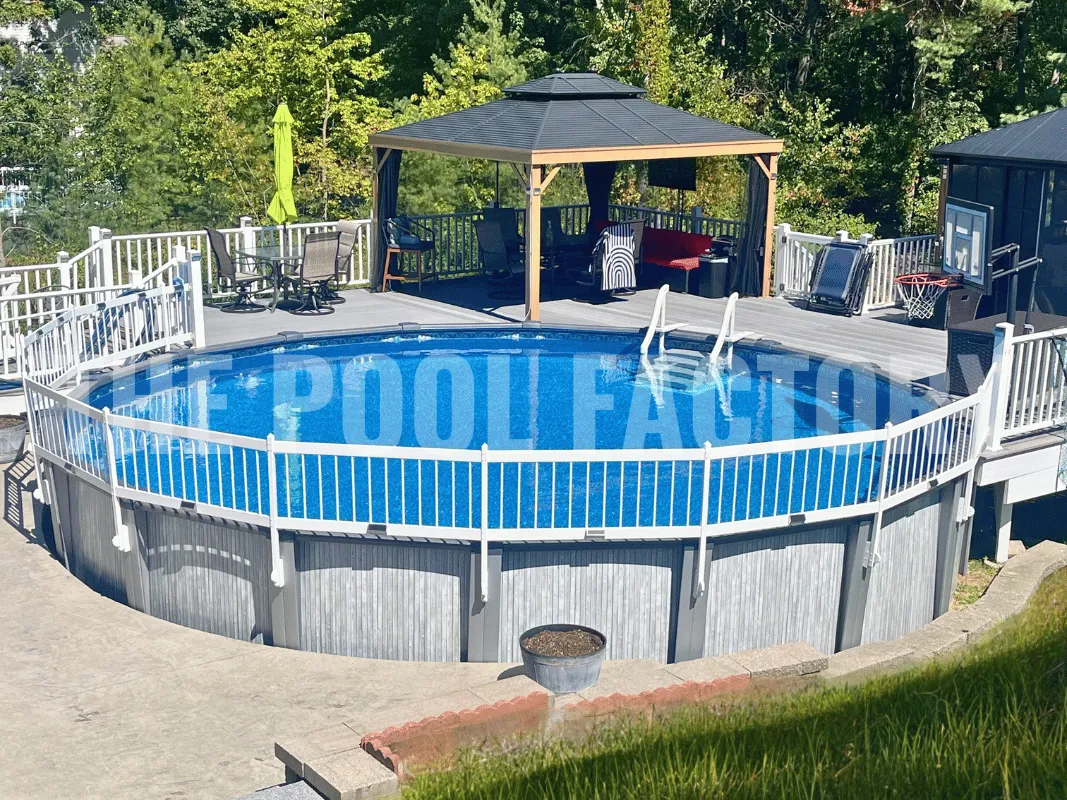 Stylish round pool surrounded by safety fence and outdoor décor