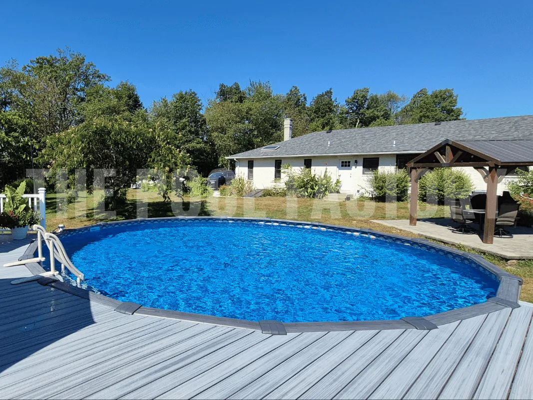 Backyard oasis with round above ground pool and deck