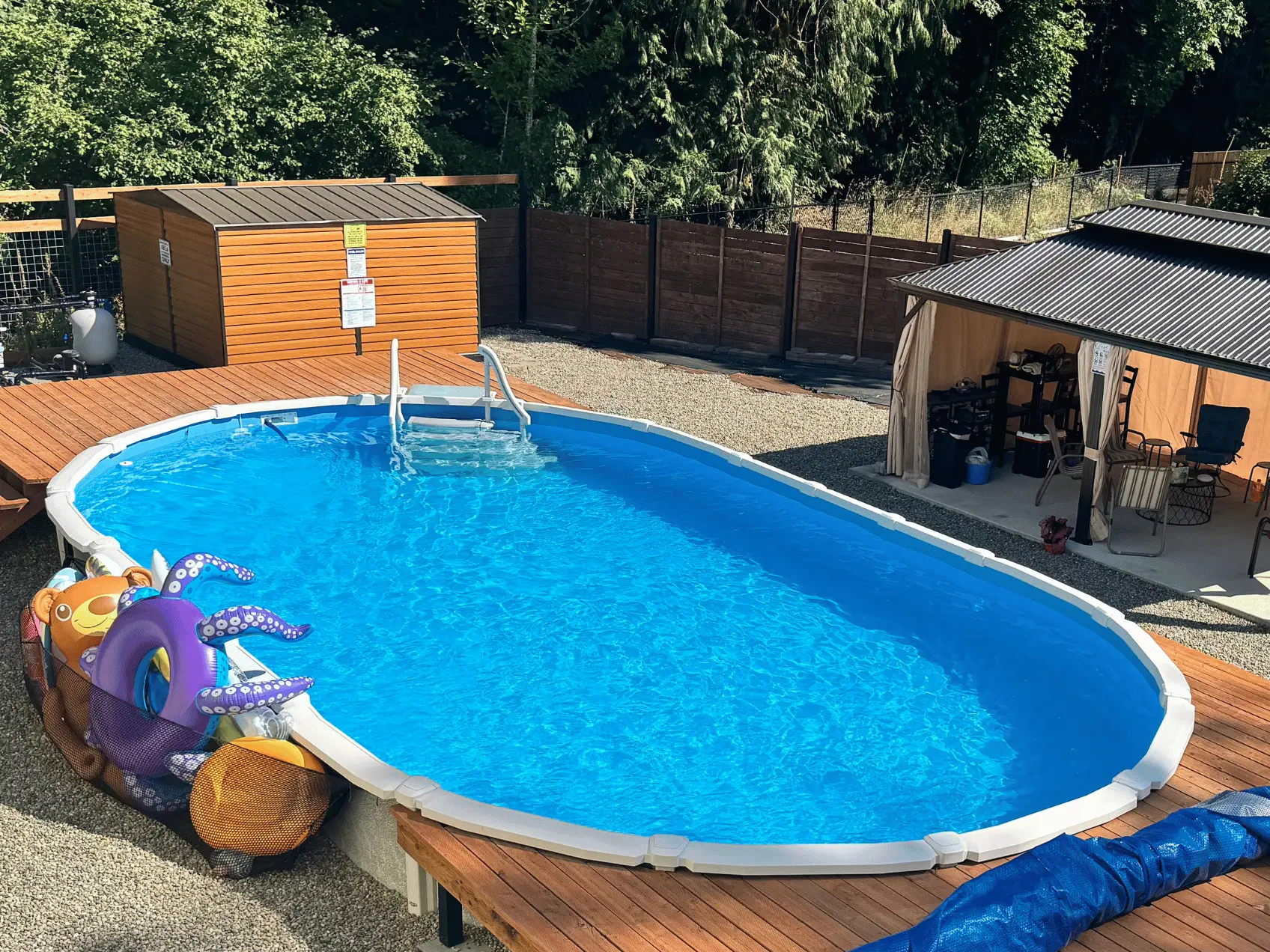 Blue oval overlap pool liner in a Saltwater 8000 oval pool.
