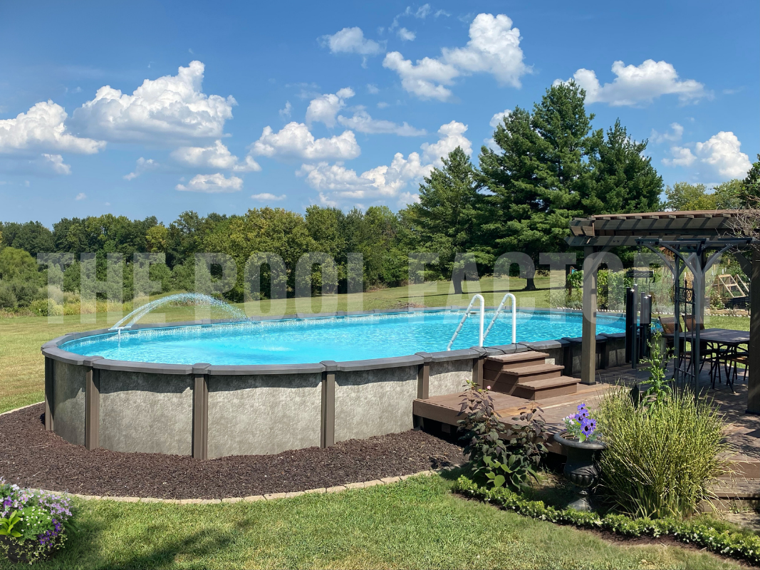 Semi-inground oval pool with mulch, surrounded by greenery and trees
