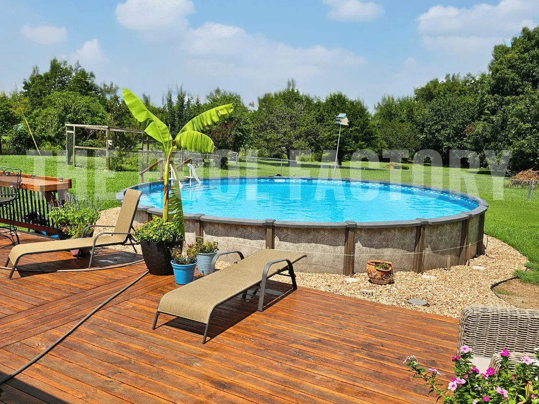 Round pool surrounded by huge plants, mulch, and deck for sun lounge chairs