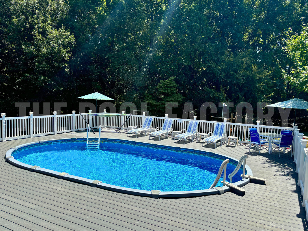 Saltwater oval swimming pool with full wrap around deck and lounge chairs 