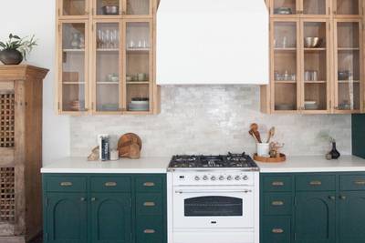 clé tile terracotta rice paper 2x6 tile installed on an kitchen backsplash with green cabinets