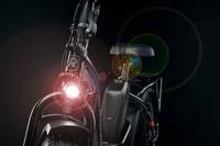 Front view or a Rad Power Bike headlight shining in the dark