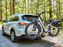 RadRover 6 Plus Electric Fat Tire Bike being carried on a rack by a sport utility vehicle