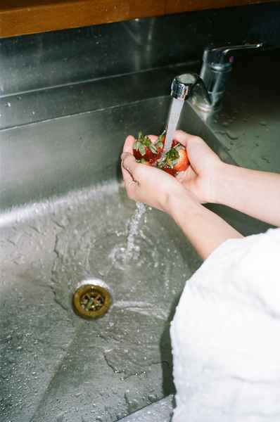 Lemon Strawberry Poppy Seed Cake KitEditorial Image of person making cake