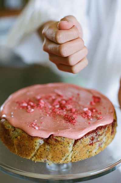 Lemon Strawberry Poppy Seed Cake KitEditorial Image of person making cake