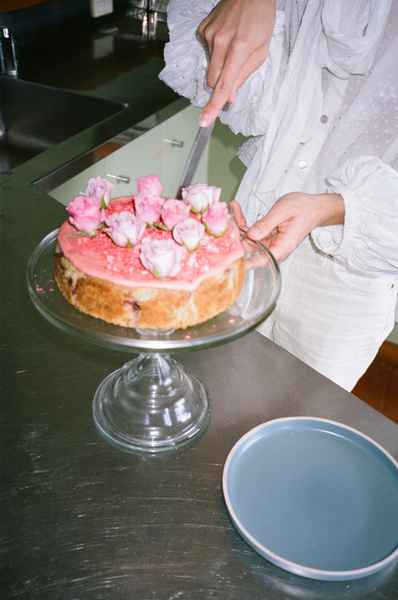 Lemon Strawberry Poppy Seed Cake KitEditorial Image of person making cake