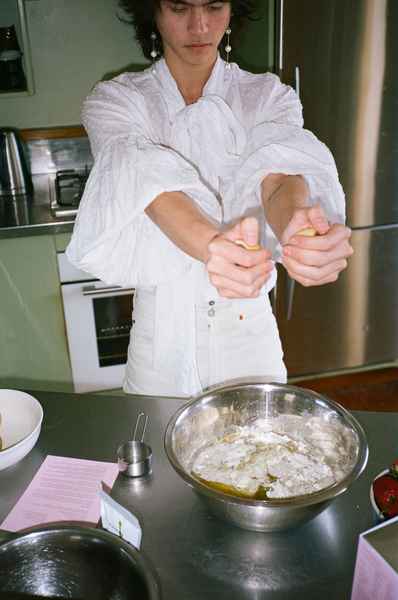 Lemon Strawberry Poppy Seed Cake KitEditorial Image of person making cake
