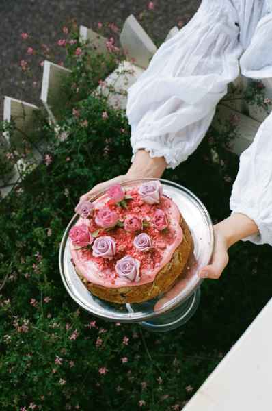 Lemon Strawberry Poppy Seed Cake KitEditorial Image of person making cake