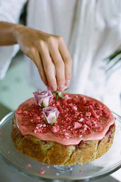 Lemon Strawberry Poppy Seed Cake KitEditorial Image of person making cake
