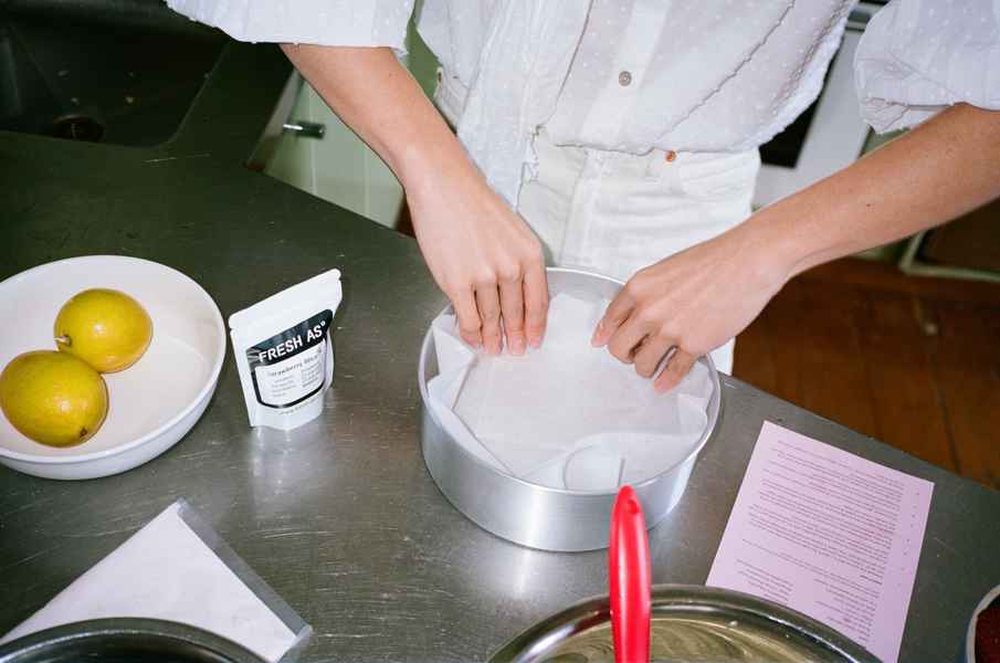 Lemon Strawberry Poppy Seed Cake KitEditorial Image of person making cake