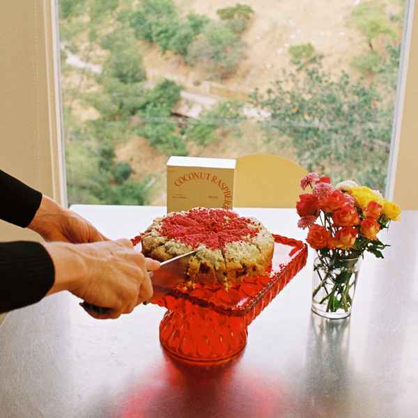 Coconut Raspberry Lime Leaf Cake KitEditorial Image of person making cake